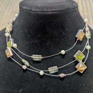multi-strand "illusion" necklace featuring green square crystals and round beads